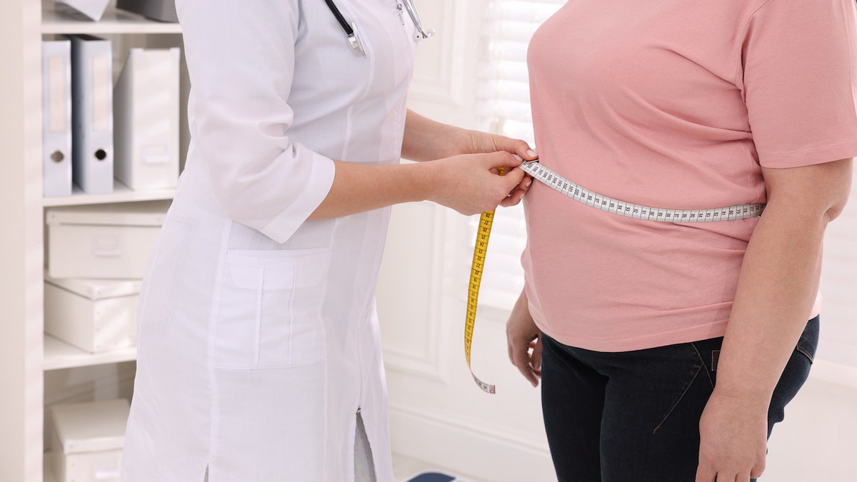 Doctor measuring patient