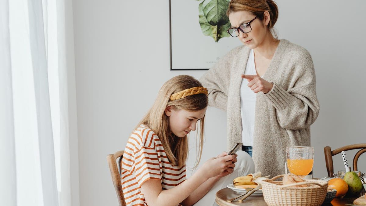 Parent and child on a cell phone