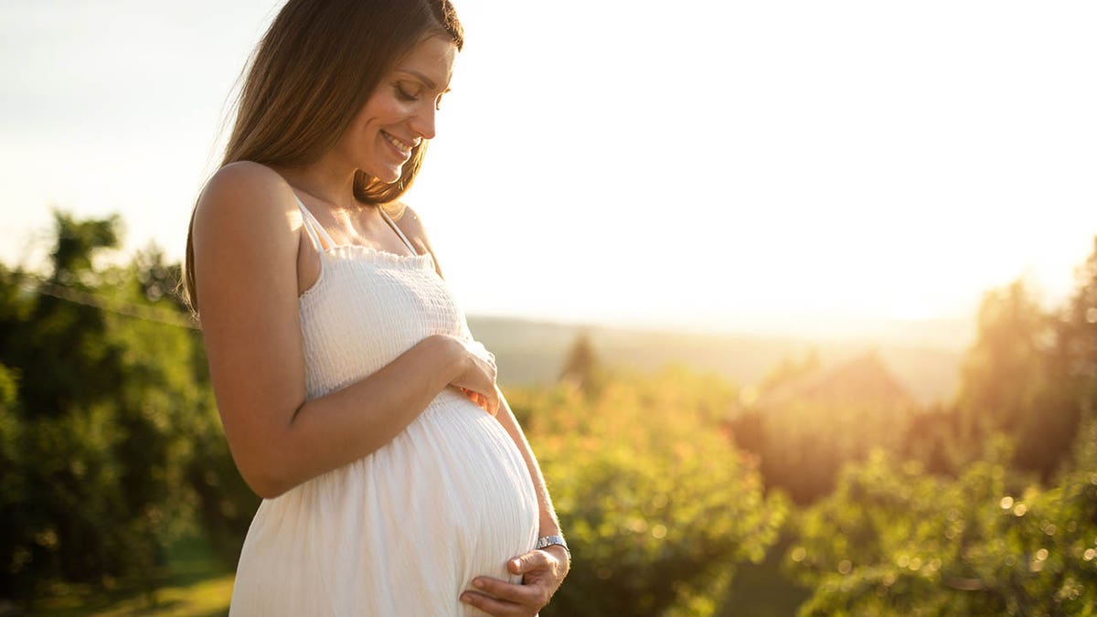 pregnant woman in the springtime