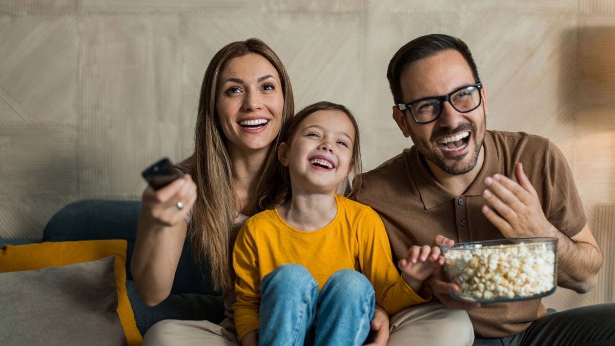 Family laughing TV