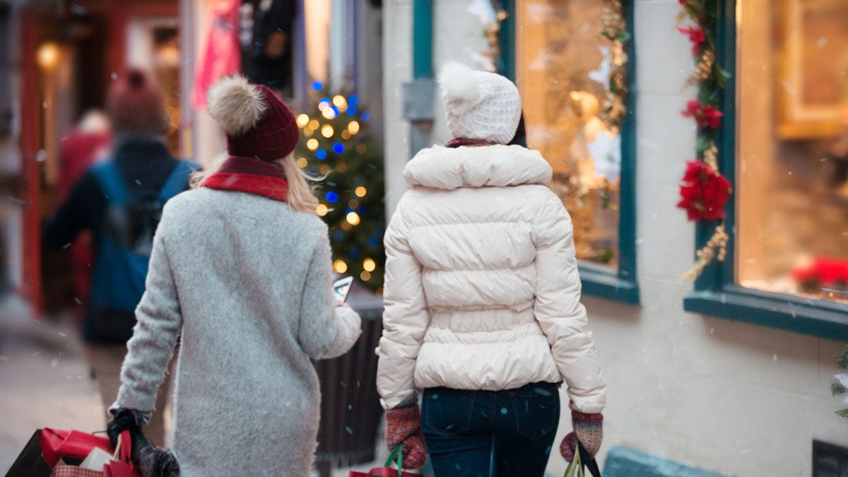 shoppers in holiday scene in stock photo