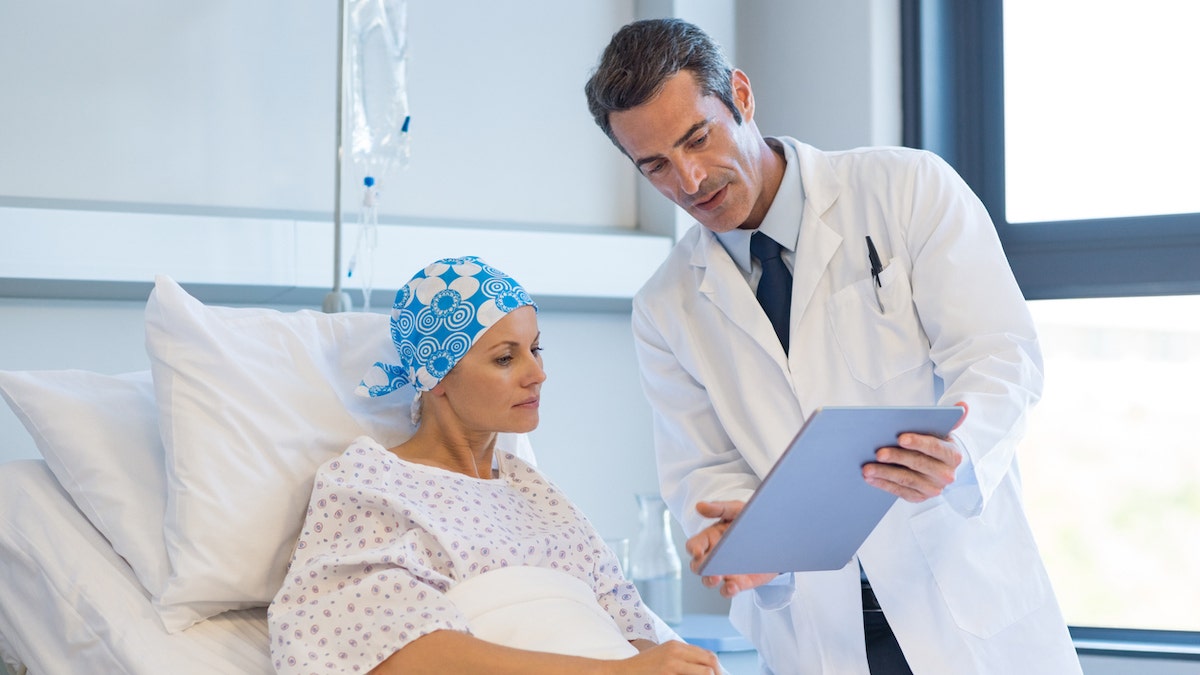 Doctor with cancer patient