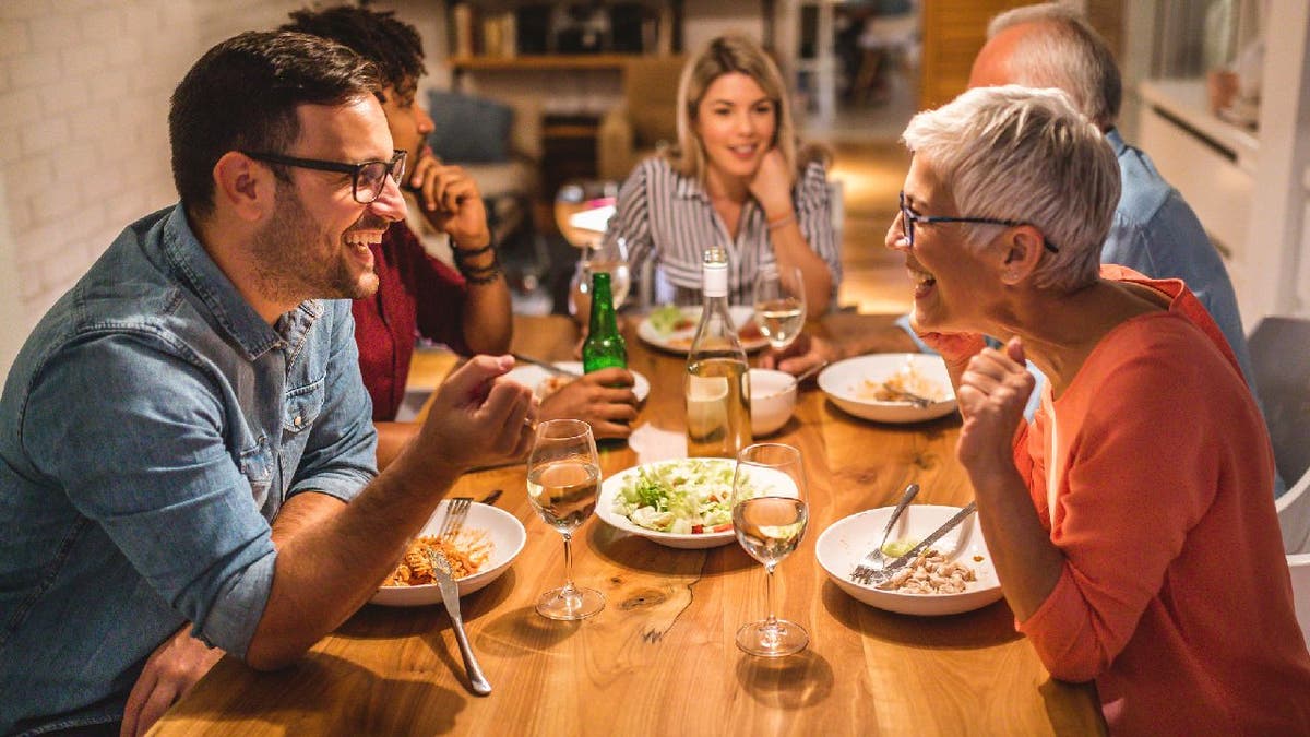 Family has a discussion at the dinner table