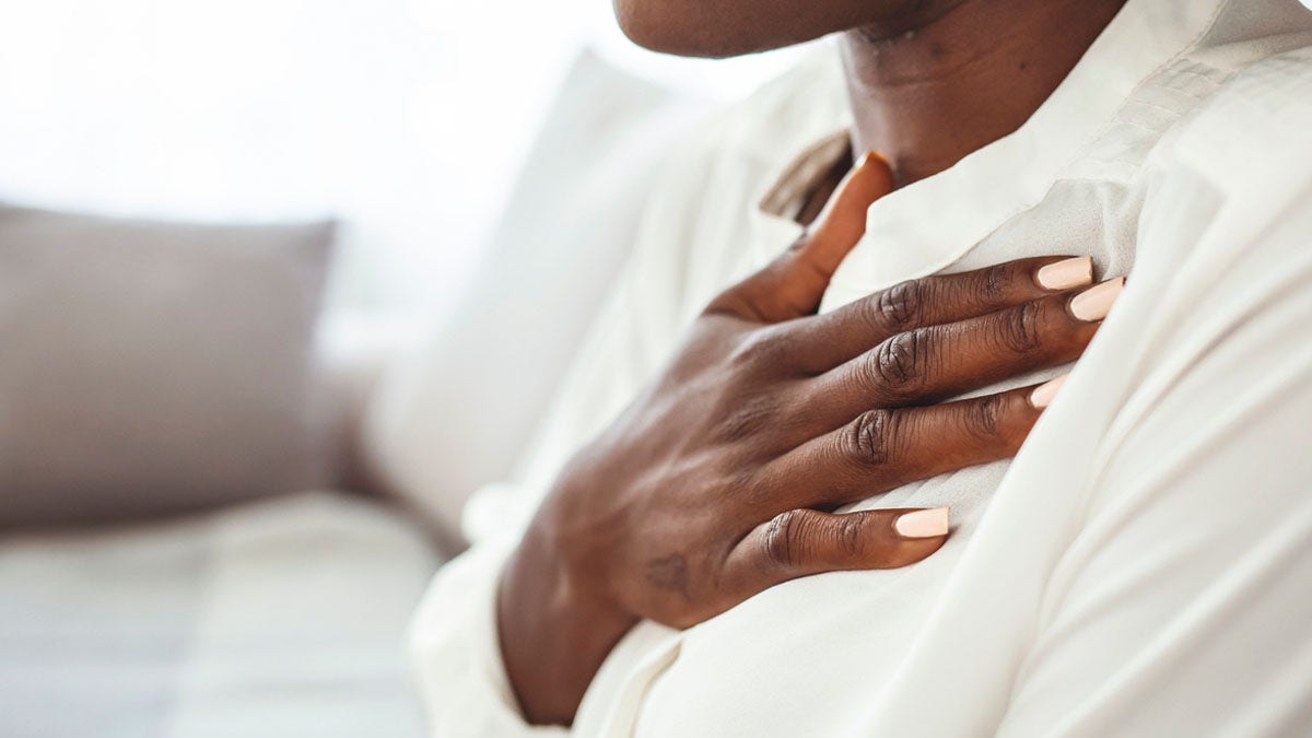 Woman holding chest