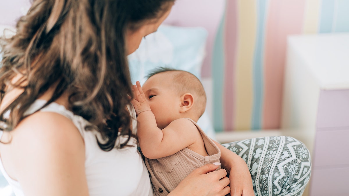 Woman nursing baby