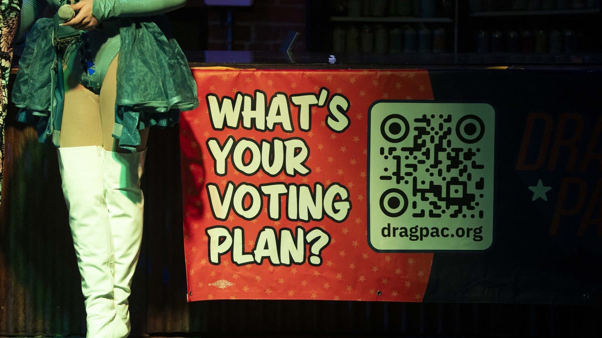 A sign is seen during a Tucson, Arizona-area rally organized by Act! With Pride Tucson and sponsored by Drag PAC.